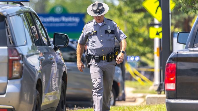 Law enforcement members respond to a shooting on Terminal Drive near the Blue Grass Airport in Lexington, Ky., Sunday, July 13, 2025. (Ryan C. Hermens/Lexington Herald-Le