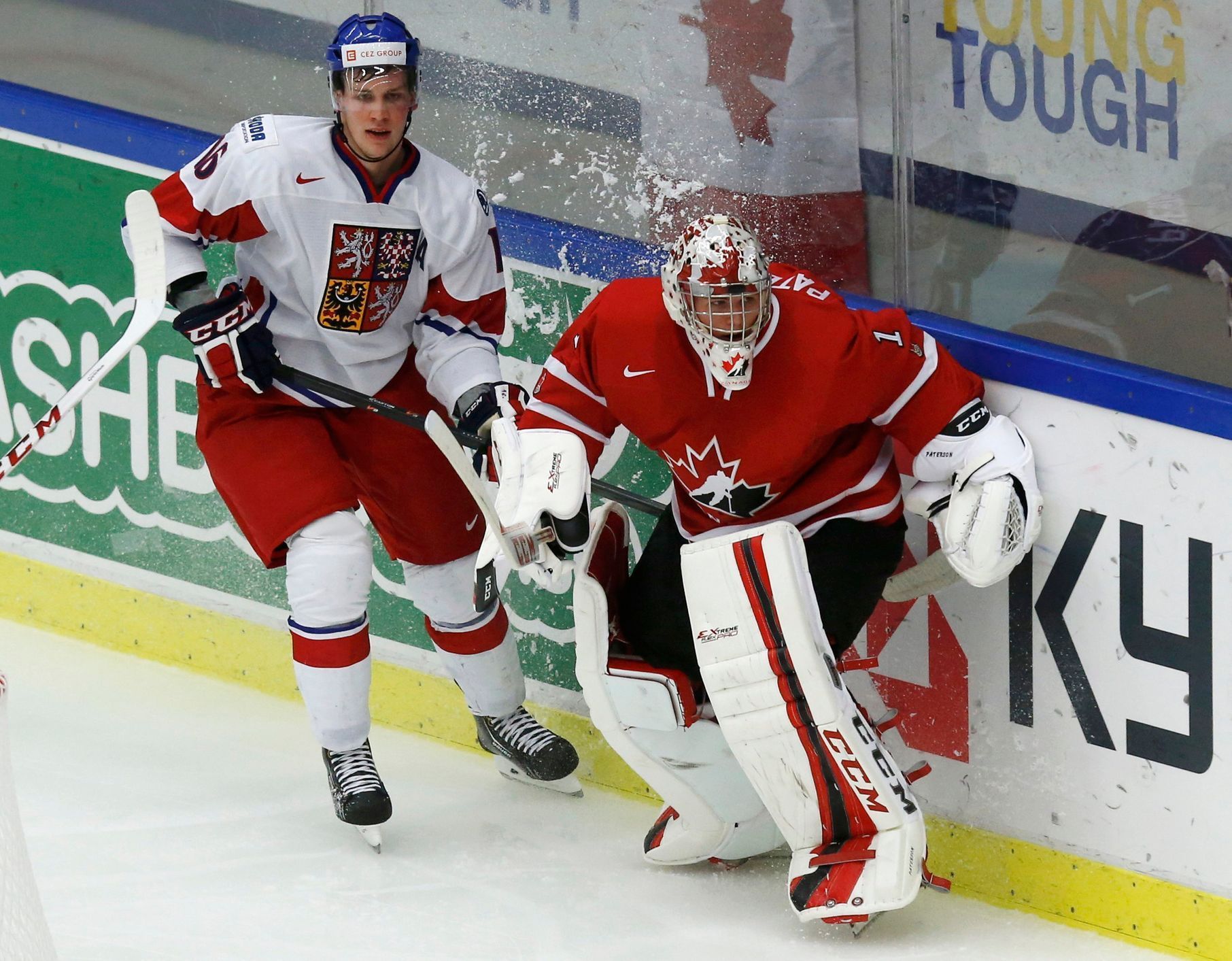 Czech Republic's Faksa and Canada's goalie Paterson bump behind the net while clearing the puck during the second period of their IIHF World Junior Championship ice hockey game in Malmo