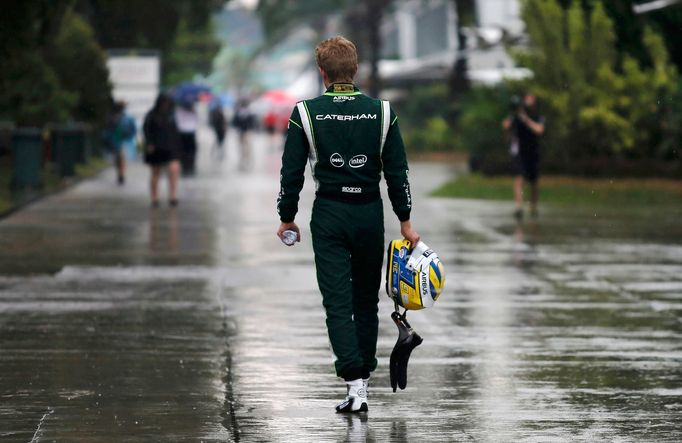 Caterham Formula One driver Marcus Ericsson of Sweden walks after crashing out in the qualifying session for the Malaysian F1 Grand Prix at Sepang International Circuit o