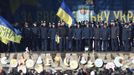 Police officers from Lviv who have arrived to join anti-government protesters appear on a stage in Independence Square in Kiev February 21, 2014.