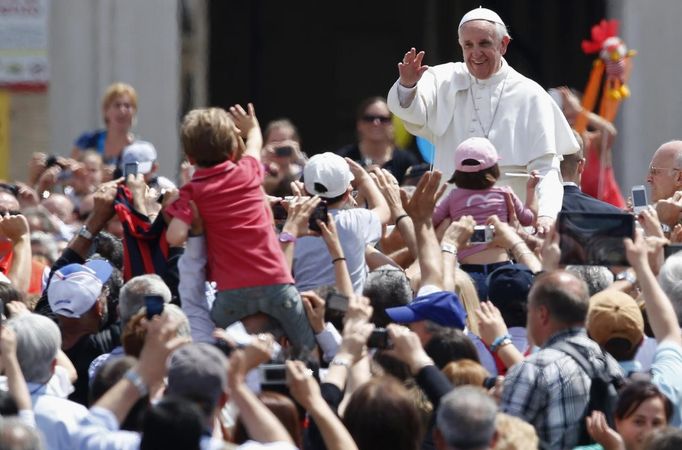 Pope Francis waves at the end of a canonization mass in Saint Peter's Square at the Vatican May 12, 2013. The Pope led a mass on Sunday for candidates for sainthood Antonio Primaldo, Mother Laura Montoya and Maria Guadalupe Garcia Zavala.