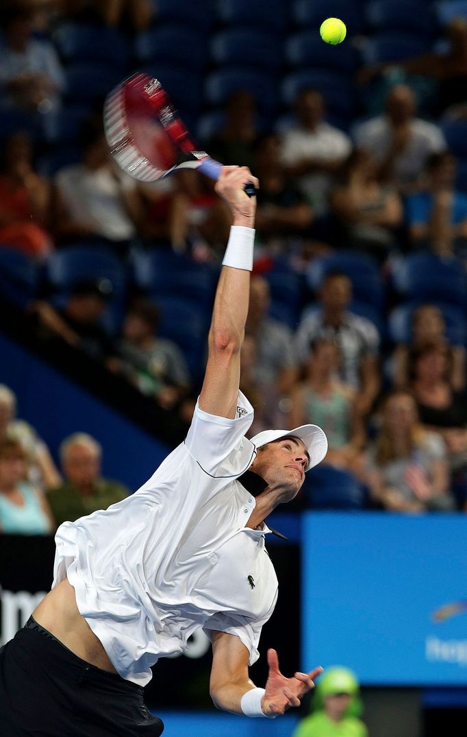 John Isner of the U.S. serves to Fabio Fognini of Italy during their men's singles tennis match at the 2015 Hopman Cup in Perth