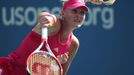 Kristina Mladenovic of France hits a return to Petra Kvitova of the Czech Republic during their match at the 2014 U.S. Open tennis tournament in New York