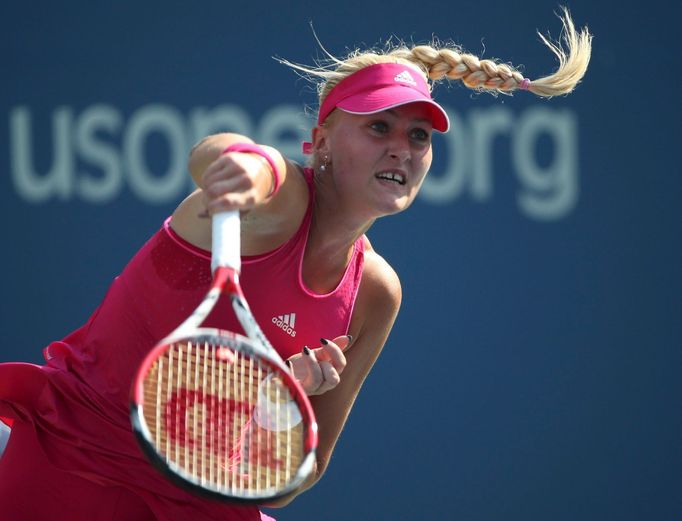 Kristina Mladenovic of France hits a return to Petra Kvitova of the Czech Republic during their match at the 2014 U.S. Open tennis tournament in New York