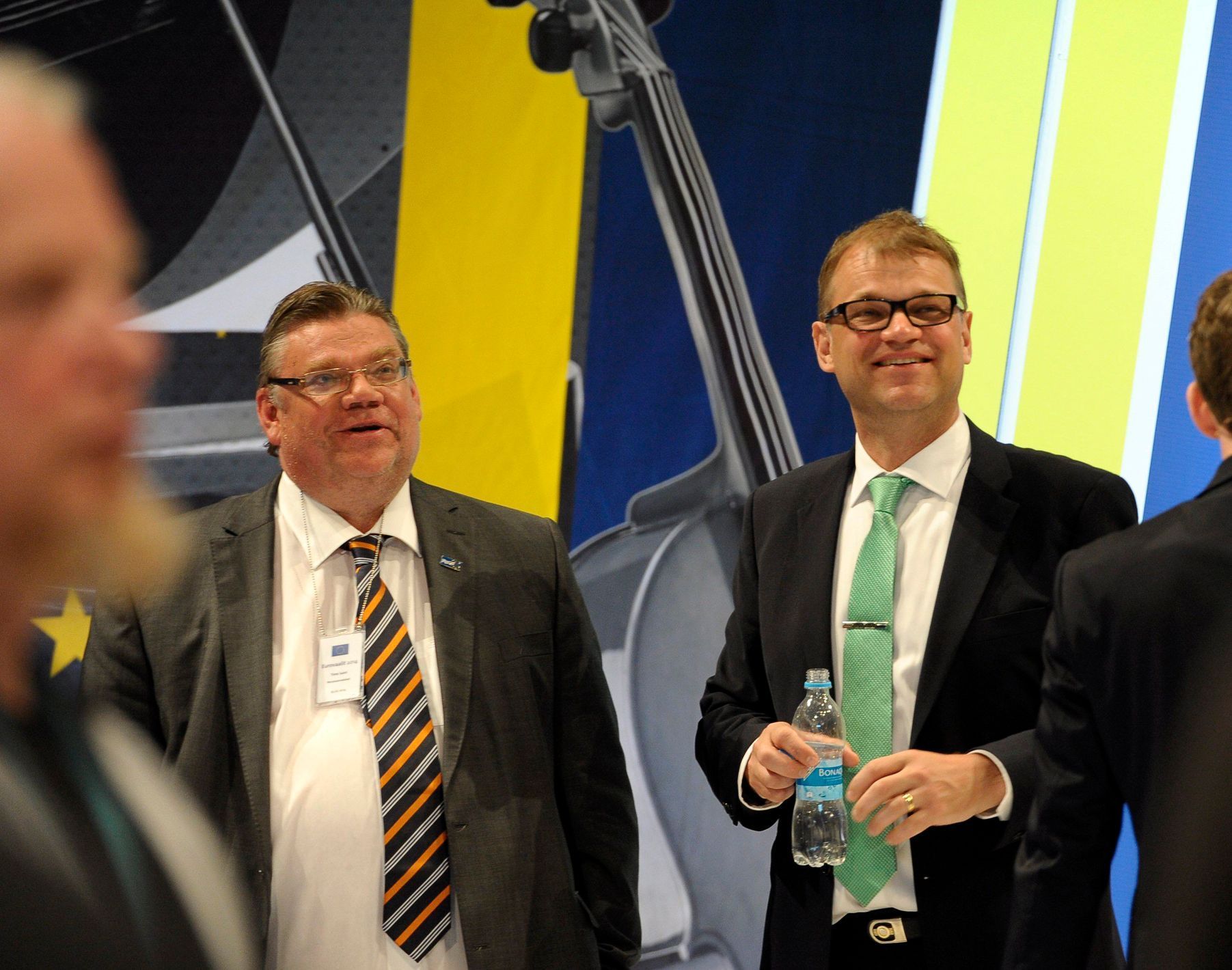 Juha Sipila and Timo Soini look on during the European Parliament elections at the Music Centre in Helsinki