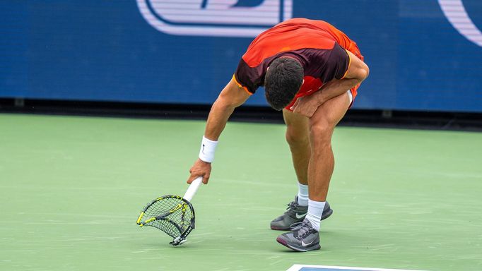 Aug 16, 2024; Cincinnati, OH, USA;  Carlos Alcaraz of Spain smashes his racket during his match against Gael Monfils of France on day five of the Cincinnati Open. Mandato