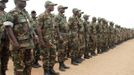 Togolese Army soldiers stand in preparation to leave for deployment to Mali from Togo's capital Lome January 17, 2013. A contingent of around 100 Togolese troops, which arrived at Bamako international airport, was due to be joined shortly afterwards by Nigerian forces already en route from Kaduna airport, in the north of the oil-producing state. REUTERS/Noel Kokou Tadegnon (TOGO - Tags: POLITICS CIVIL UNREST) Published: Led. 17, 2013, 8:32 odp.