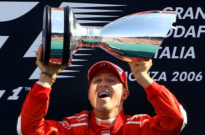 FILE PHOTO: Ferrari Formula One driver Michael Schumacher of Germany lifts the trophy on the podium after winning the Italian Grand Prix at the Monza race track in northe