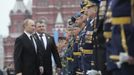 Russian President Vladimir Putin (L) and acting Defence Minister Anatoly Serdyukov (2nd L) inspect the Victory Parade on Moscow's Red Square May 9, 2012. Russia celebrates the 67th anniversary of victory over Nazi Germany on Wednesday. REUTERS/Alexsey Druginyn/RIA Novosti/Pool (RUSSIA - Tags: POLITICS ANNIVERSARY) THIS IMAGE HAS BEEN SUPPLIED BY A THIRD PARTY. IT IS DISTRIBUTED, EXACTLY AS RECEIVED BY REUTERS, AS A SERVICE TO CLIENTS Published: Kvě. 9, 2012, 9:58 dop.