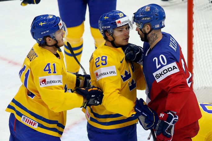 Jakub Klepis of the Czech Republic (R) argues with Sweden's Erik Gustafsson (C) and Gustav Nyquist (L) during the first period of their men's ice hockey World Championshi