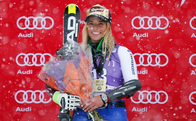 Lara Gut of Switzerland poses at the top of the podium during the women's giant slalom race at the FIS alpine skiing World Cup at Aspen Snowmass. Mandatory Credit: Jeff S