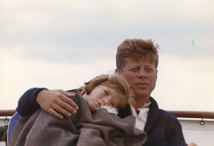 Former United States President John F. Kennedy sits on a yacht with his daughter Caroline off Hyannis Port, Massachusetts, in this handout image taken on August 25, 1963.