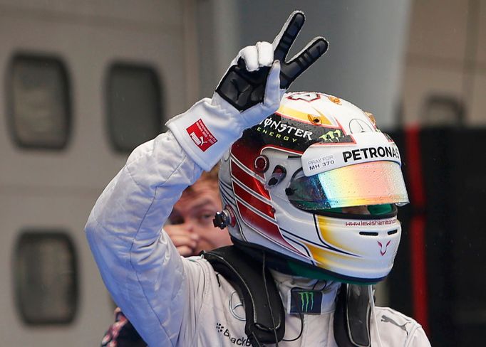 Mercedes Formula One driver Lewis Hamilton of Britain gestures after the qualifying session for the Malaysian F1 Grand Prix at Sepang International Circuit outside Kuala