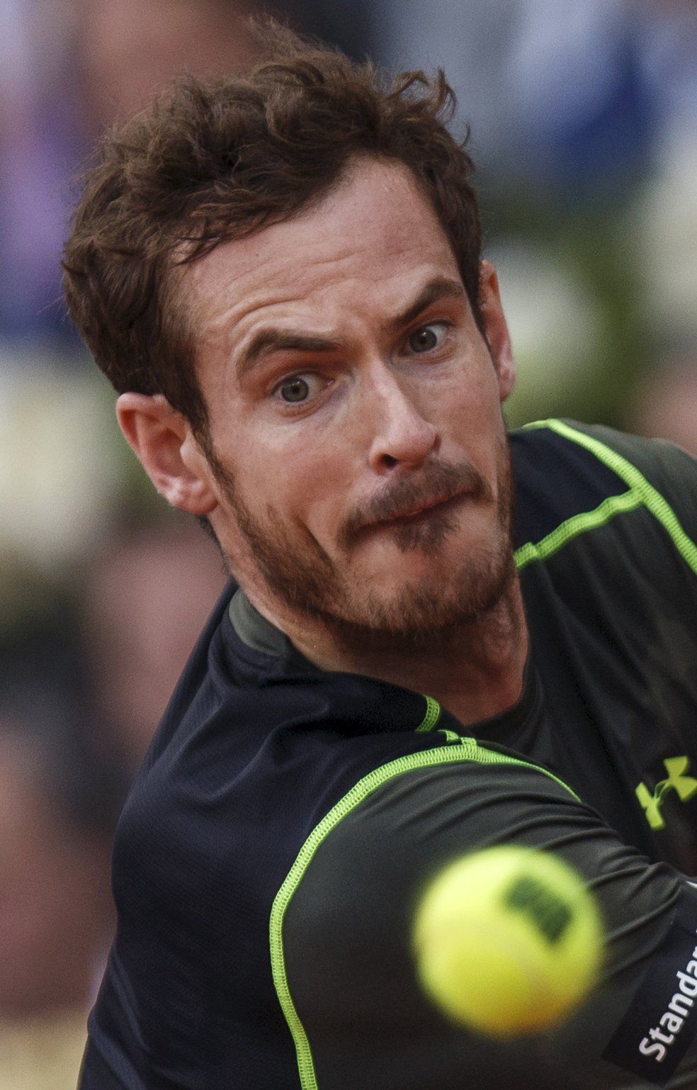 Britain's Murray eyes the ball before returning a backhand to Spain's Nadal during their final match at the Madrid Open tennis tournament in Madrid