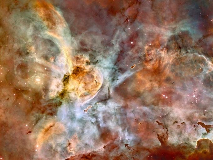 In celebration of the 17th anniversary of the launch and deployment of NASA's Hubble Space Telescope, this, one of the largest panoramic images ever taken with Hubble's cameras, is being released. It is a 50-light-year-wide view of the central region of the Carina Nebula where a maelstrom of star birth - and death - is taking place. This image is a mosaic of the nebula assembled from 48 frames taken with Hubble's Advanced Camera for Surveys. The images were taken in the light of neutral hydrogen. Color information was added using data from the Cerro Tololo Inter-American Observatory in Chile. Red corresponds to sulfur, green to hydrogen, and blue to oxygen emission.