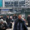 People leave the scene of explosions at Zaventem airport near Brussels, Belgium