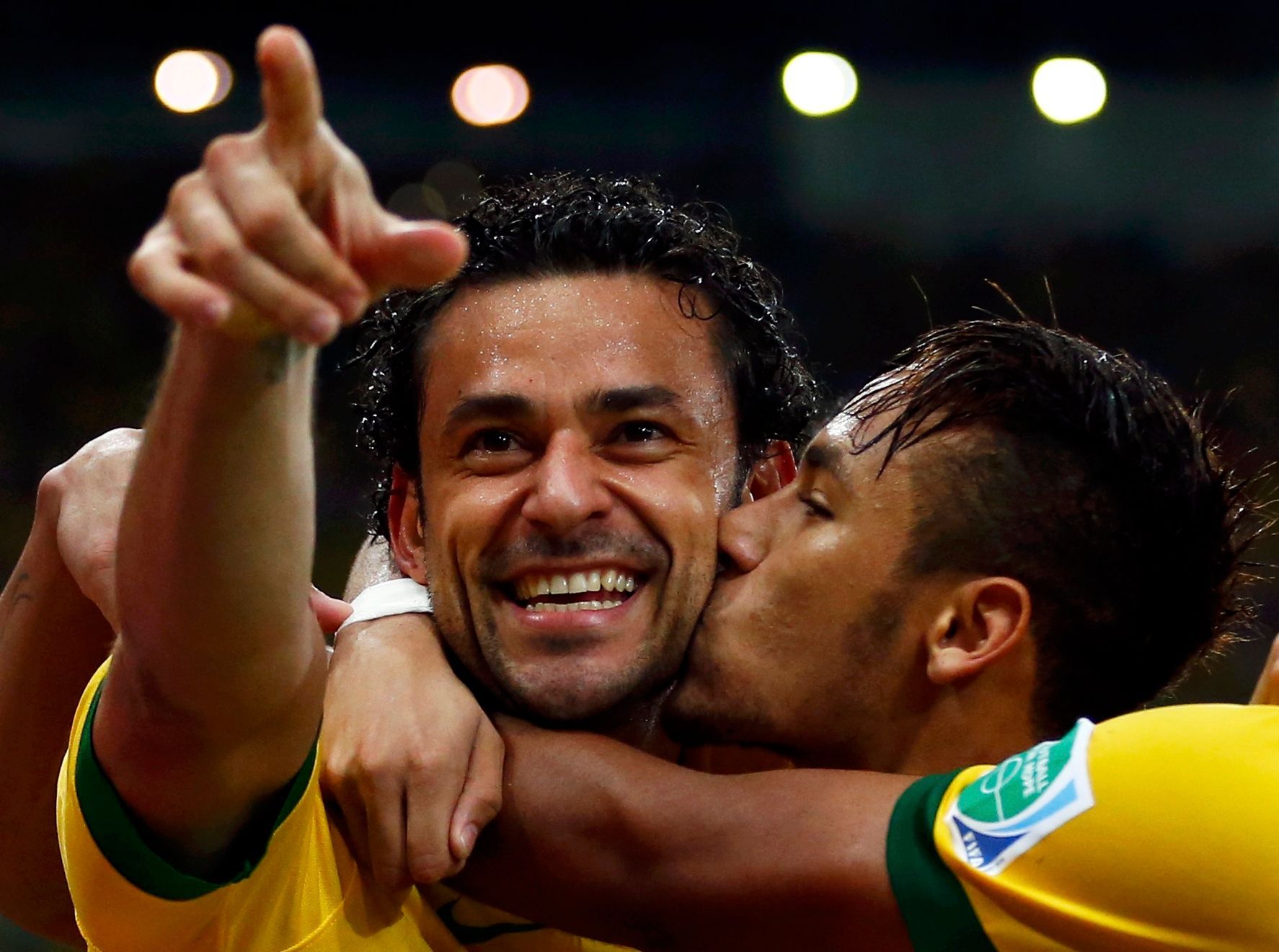 Brazil's Fred celebrates with teammate Neymar after scoring