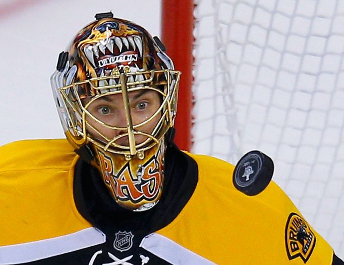 Boston Bruins goalie Tuukka Rask keeps his eyes on the puck in the first overtime period of Game 1 of their NHL Eastern Conference semi-final hockey playoff series agains