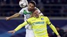 VfL Wolfsburg's Ricardo Rodriguez in action against KAA Gent's Thomas Foket (R).