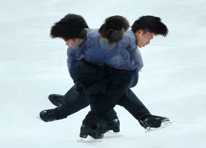 Japanese figure skater Tatsuki Machida practises in preparation for the 2014 Sochi Winter Olympics, February 4, 2014. Picture taken using multiple exposure. REUTERS/Lucy