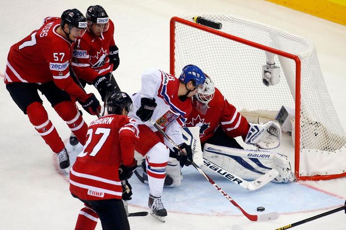 Tomas Hertl of the Czech Republic (C) scores past Canada's goaltender James Reimer (R) during the third period of their men's ice hockey World Championship group A game a