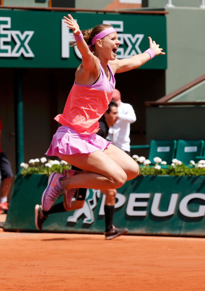 Lucie Safarova of Czech Republic celebrates after winning with Mattek-Sands of the US their women's doubles final match against Dellacqua of Australia and Shvedova of Kaz