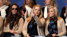 Wives and partners Sybi Kuchar, Kandi Mahan and Amy Mickelson of U.S. Team players, sit together for the opening ceremony of the 40th Ryder Cup at Gleneagles