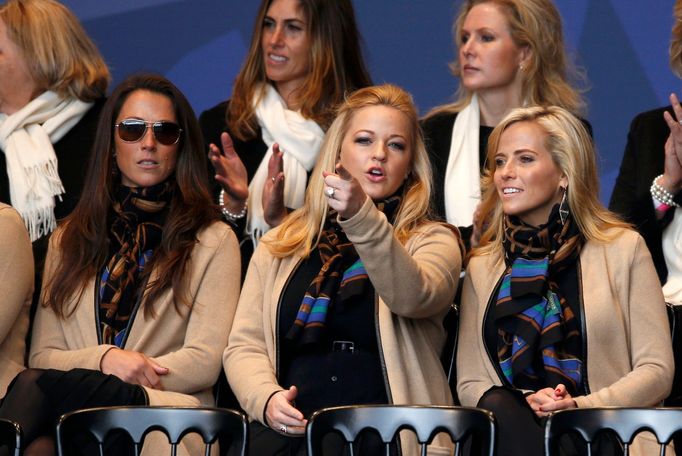 Wives and partners Sybi Kuchar, Kandi Mahan and Amy Mickelson of U.S. Team players, sit together for the opening ceremony of the 40th Ryder Cup at Gleneagles