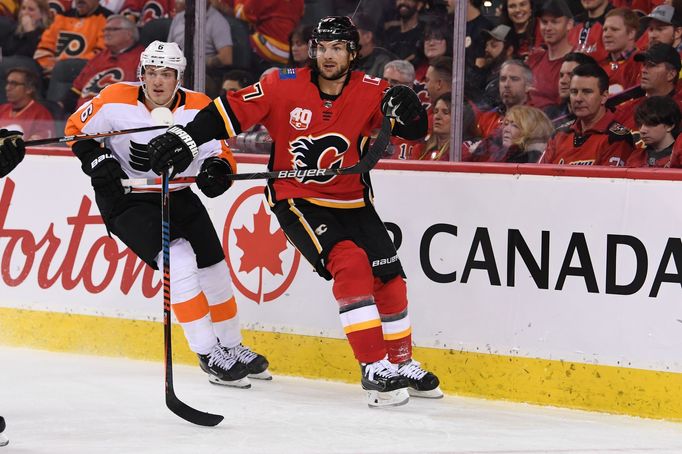 Oct 15, 2019; Calgary, Alberta, CAN; Philadelphia Flyers defenseman Travis Sanheim (6) defends against Calgary Flames right wing Michael Frolík (67) during the third peri