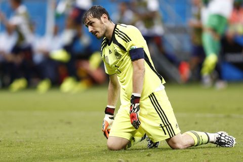 Spain's goalkeeper  Iker Casillas reacts after a goal by Netherlands during their  2014 World Cup Group B soccer match at the Fonte Nova arena in Salvador