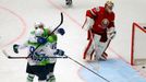 Slovenia's Ziga Pance (centre L) celebrates with his teammates after scoring a goal past Belarus' goaltender Kevin Lalande (R) during their Ice Hockey World Championship