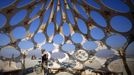 Bingram Lai explores "Zonotopia and the Two Trees" during the Burning Man 2012 "Fertility 2.0" arts and music festival in the Black Rock Desert of Nevada, August 29, 2012. More than 60,000 people from all over the world have gathered at the sold out festival, which is celebrating its 26th year, to spend a week in the remote desert cut off from much of the outside world to experience art, music and the unique community that develops.