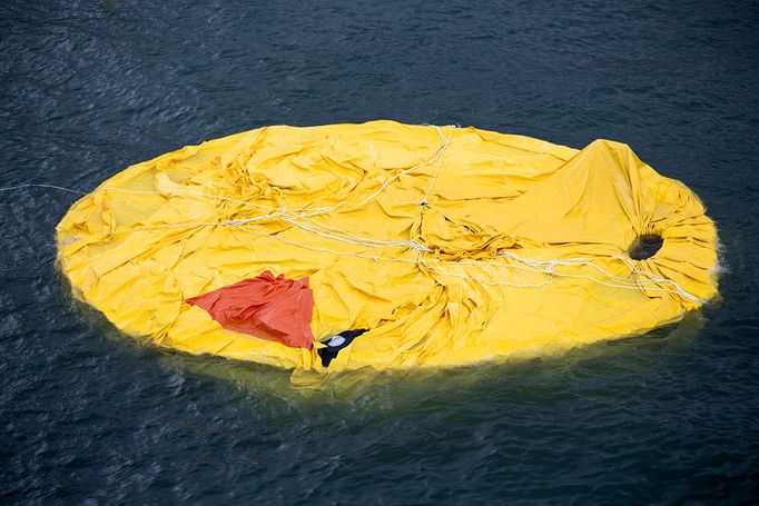 Hong Kong Rubber Duck 2013-05-15 00:00:00 epa03700686 Dutch conceptual artist Florentijn Hofman's 'Rubber Duck' floats, deflated and flattened on Victoria Harbour, Hong Kong, China, 15 May 2013. It is not immediately known why the duck, scheduled to float outside Ocean Terminal inTsim Sha Tsui until 09 June deflated. EPA/JEROME FAVRE