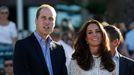 Britain's Prince William and his wife Catherine, the Duchess of Cambridge, stand next to each other during their visit to a surf lifesaving demonstration at Sydney's Manl