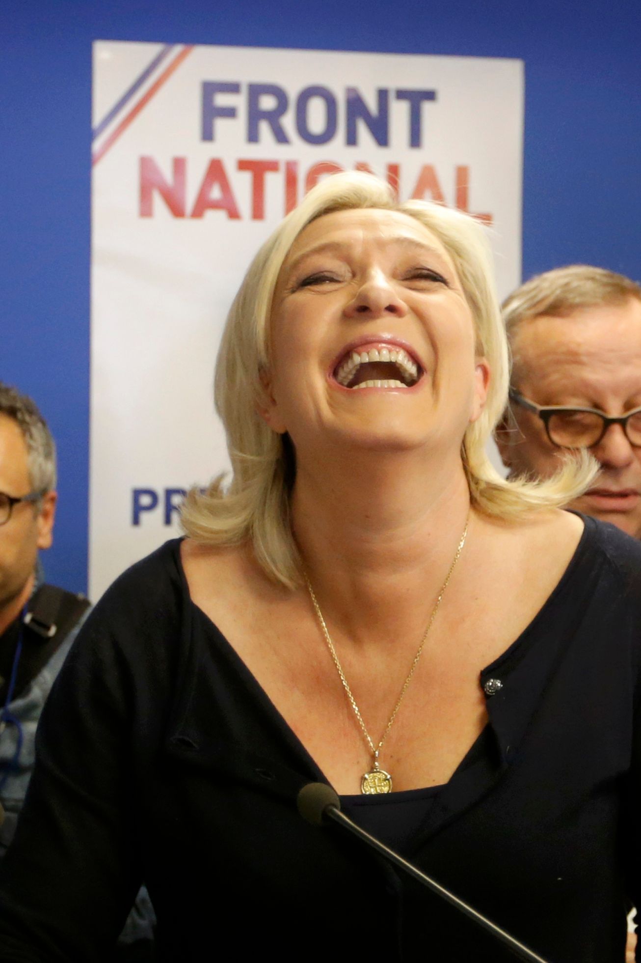 Marine Le Pen, France's National Front political party head, reacts to results after the polls closed in the European Parliament elections at the party's headquarters in Nanterre