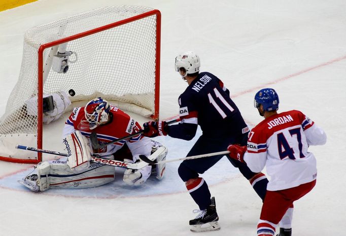 Brock Nelson of the U.S. (C) scores against Czech Republic goalie Alexander Salak during their men's ice hockey World Championship quarter-final game at Chizhovka Arena i