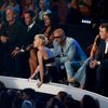 Miley Cyrus waits on the side of stage as a spokesperson named Jesse accepts the award for video of the year for her song &quot;Wrecking Ball&quot; during the 2014 MTV Video Music Awards in Inglewood