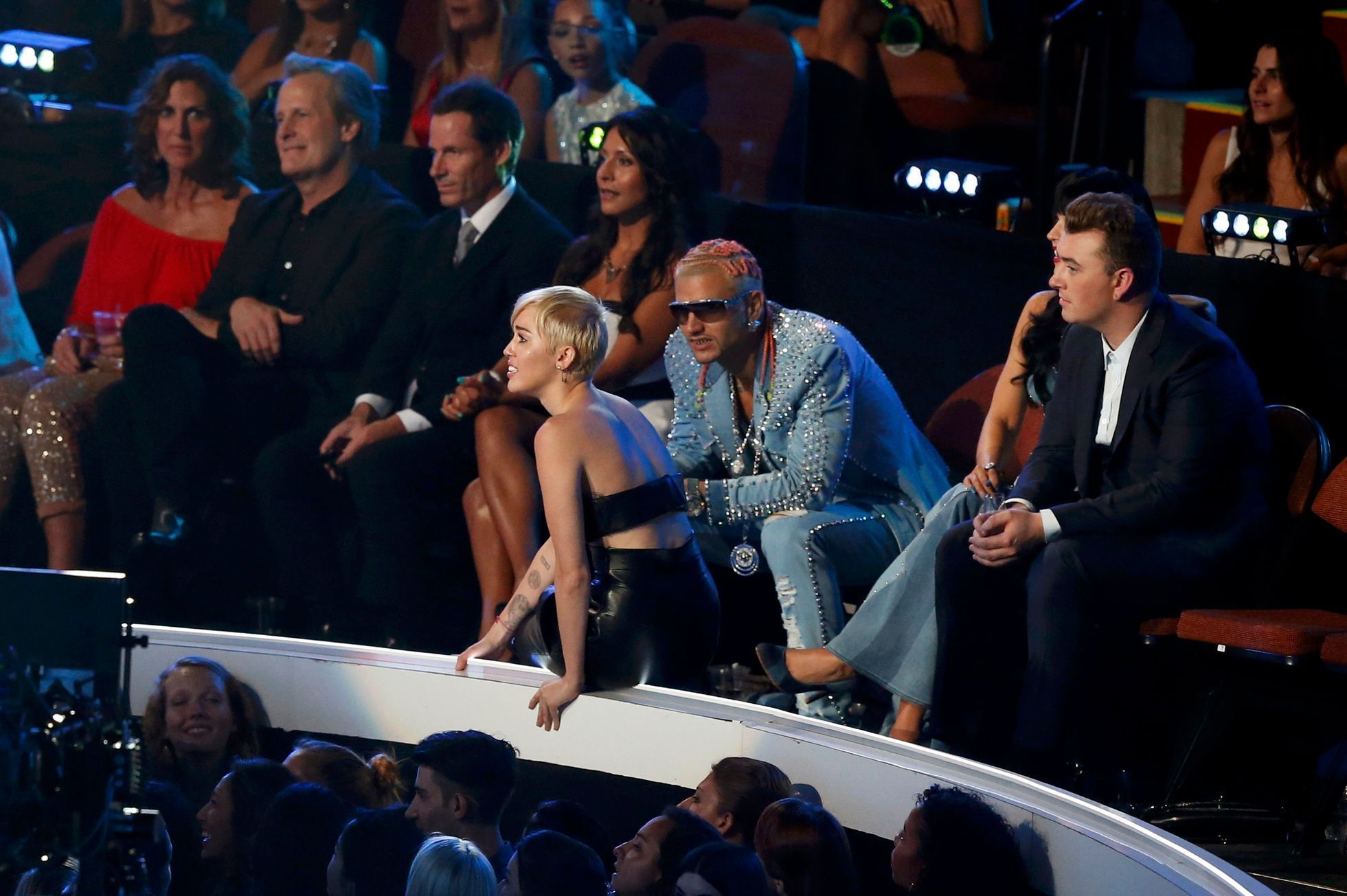 Miley Cyrus waits on the side of stage as a spokesperson named Jesse accepts the award for video of the year for her song &quot;Wrecking Ball&quot; during the 2014 MTV Video Music Awards in Inglewood