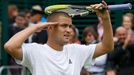 Mikhail Youzhny of Russia reacts after defeating Robin Haase of the Netherlands in their men's singles tennis match at the Wimbledon Tennis Championships, in London June