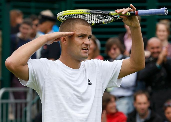 Mikhail Youzhny of Russia reacts after defeating Robin Haase of the Netherlands in their men's singles tennis match at the Wimbledon Tennis Championships, in London June