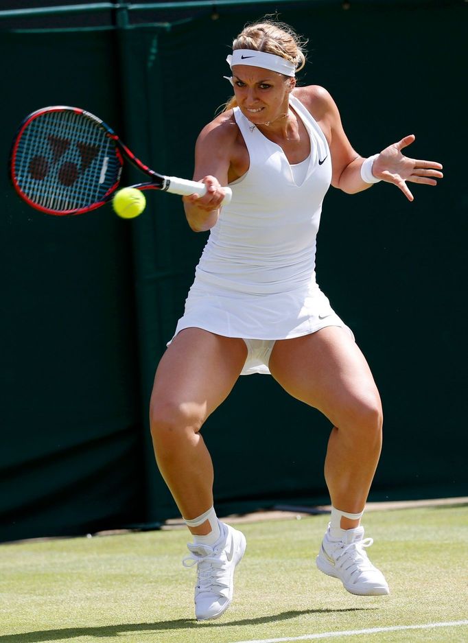 Sabine Lisicki of Germany hits a shot during her match against Timea Bacsinszky of Switzerland at the Wimbledon Tennis Championships in London