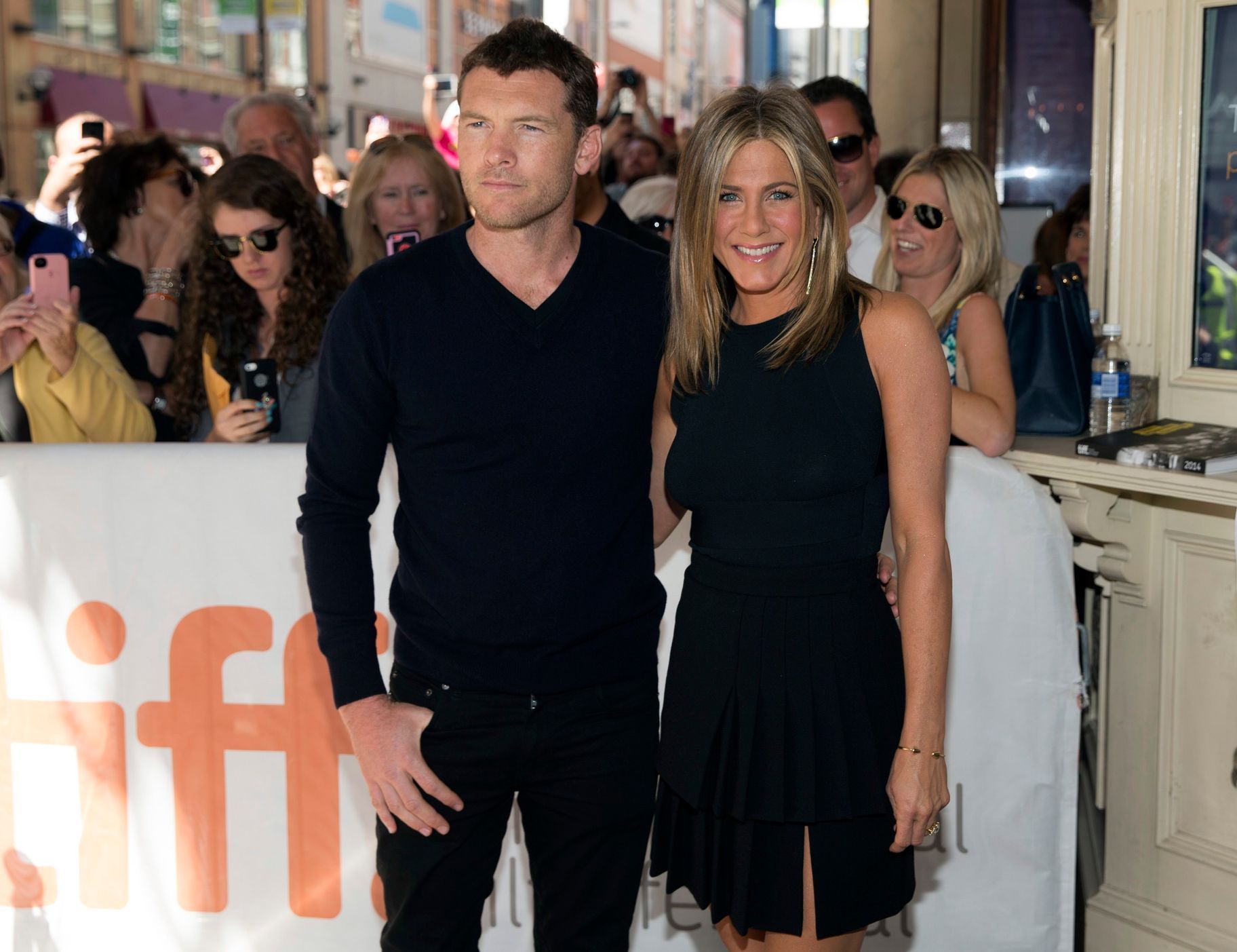 Aniston arrives with Worthington for the "Cake  at the Toronto International Film Festival in Toronto