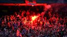 Atletico Madrid supporters light a flare as they celebrate their first goal during their Champions League final soccer match against Real Madrid, at a fan zone at Vicente