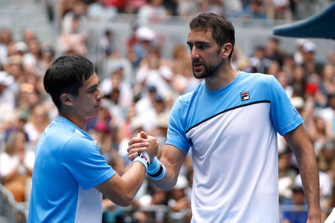 Tennis - Australian Open - Second Round - Melbourne Park, Melbourne, Australia, January 16, 2019. Croatia's Marin Cilic shakes hands with Mackenzie McDonald of the U.S. a