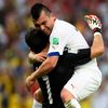 Chile's Medel hugs Bravo after the team scored their first goal against Spain during their 2014 World Cup Group B soccer match in Rio de Janeiro
