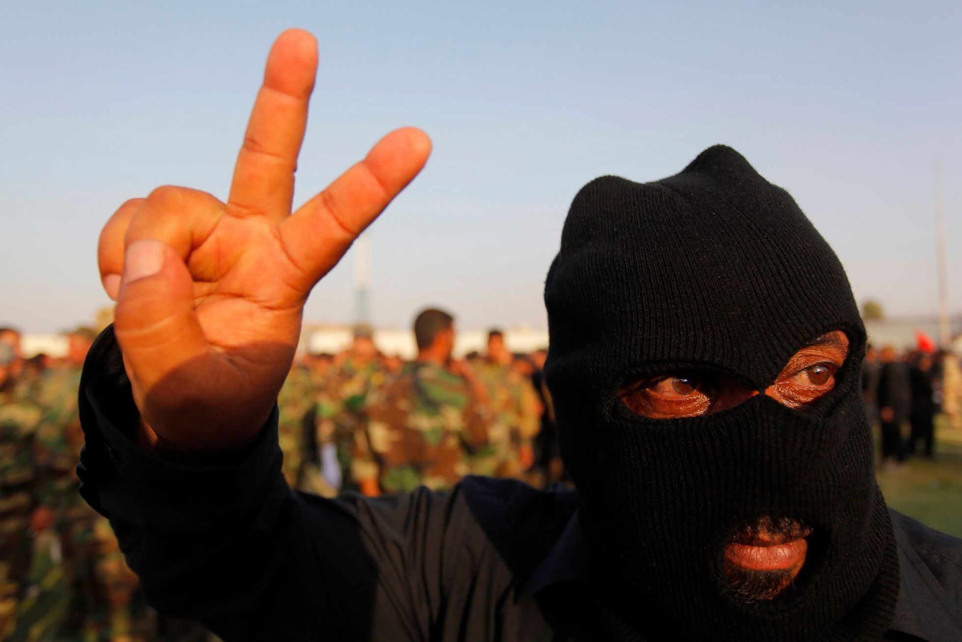 A Mehdi Army fighter loyal to Shi'ite cleric Moqtada al-Sadr gestures during military-style training in Najaf