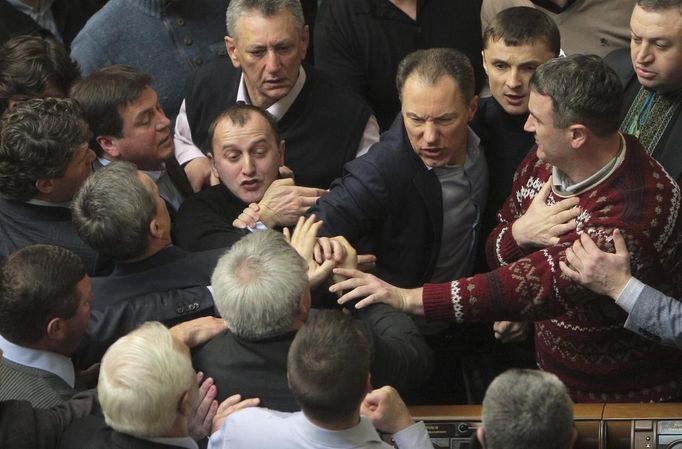 Ukrainan deputies fight during a session of parliament in Kiev February 21, 2014. Fighting broke out between deputies in Ukraine's parliament on Friday when the speaker d