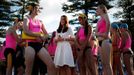 Catherine, Britain's Duchess of Cambridge, meets with junior surf lifesavers during her visit to a surf lifesaving demonstration at Sydney's Manly beach