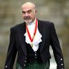 FILE PHOTO: Sir Sean Connery wearing full highland dress walks towards waiting journalists after he was formally knighted by the Britain's Queen Elizabeth at Holyrood Palace in Edinburgh