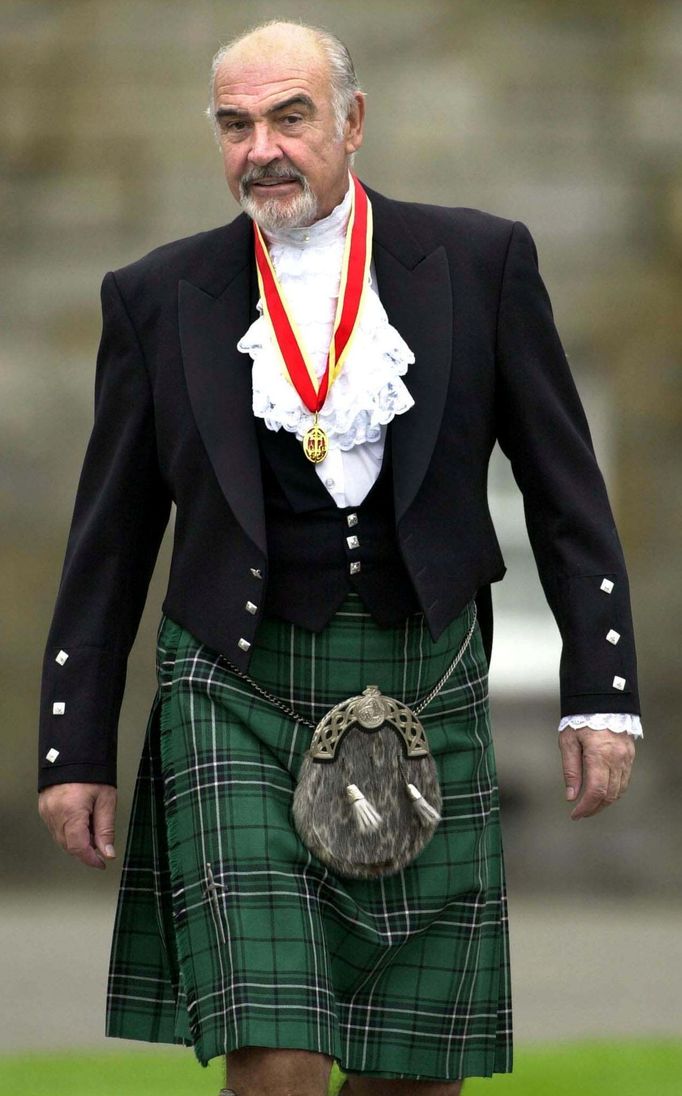 FILE PHOTO: Sir Sean Connery wearing full highland dress walks towards waiting journalists after he was formally knighted by the Britain's Queen Elizabeth at Holyrood Pal